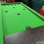 Refurbished and re-covered bar billiards table with new cast pocket rings